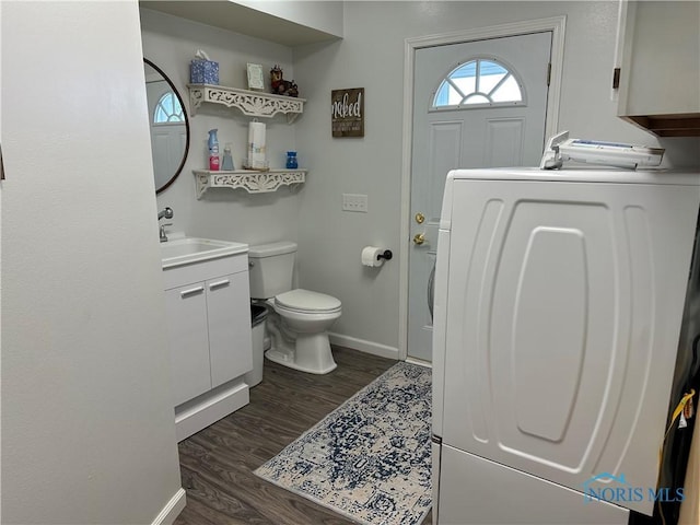 20515 Lockwood Rd, Defiance, OH 43512 - bathroom featuring washer / dryer, vanity, toilet, baseboards, and wood finished floors