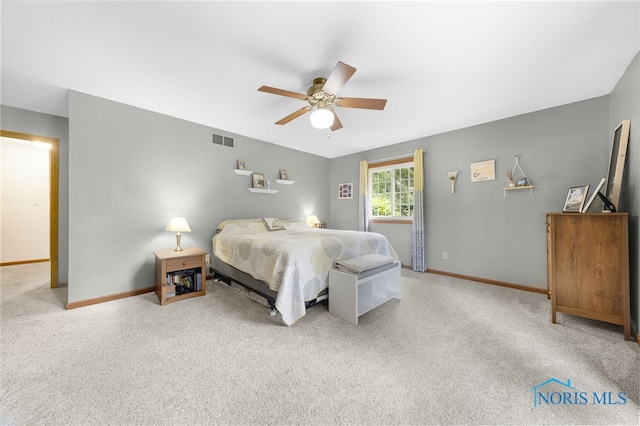 9389 County Road N2, Napoleon, OH 43535 - carpeted bedroom with baseboards and ceiling fan
