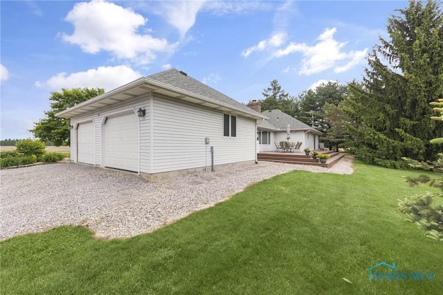 9389 County Road N2, Napoleon, OH 43535 - back of house with a yard, a deck, a garage, and a chimney