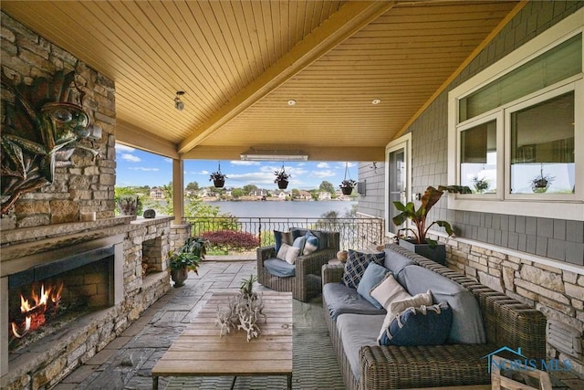 3051 Deep Water Ln, Maumee, OH 43537 - view of patio / terrace with an outdoor living space with a fireplace and a water view