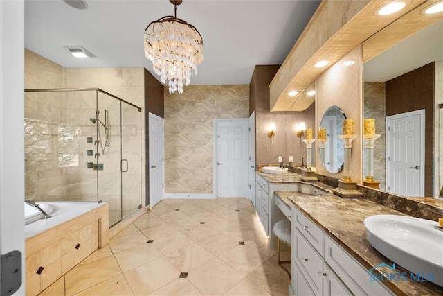 3051 Deep Water Ln, Maumee, OH 43537 - bathroom with wallpapered walls, vanity, a stall shower, a garden tub, and a chandelier
