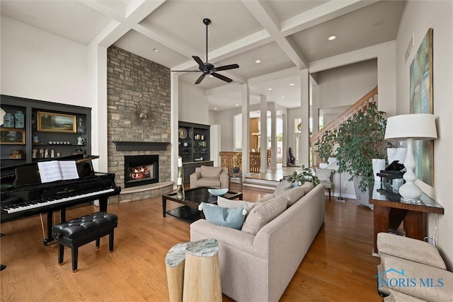 3051 Deep Water Ln, Maumee, OH 43537 - living room with coffered ceiling, wood finished floors, a ceiling fan, beam ceiling, and a fireplace