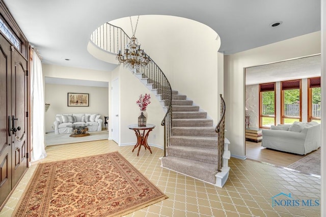 4123 Shamley Green Dr, Toledo, OH 43623 - entrance foyer with light carpet, stairway, and baseboards