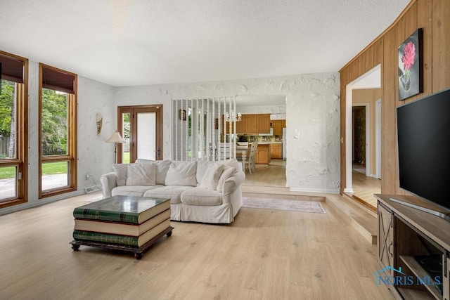 4123 Shamley Green Dr, Toledo, OH 43623 - living area featuring light wood-style floors and a textured ceiling