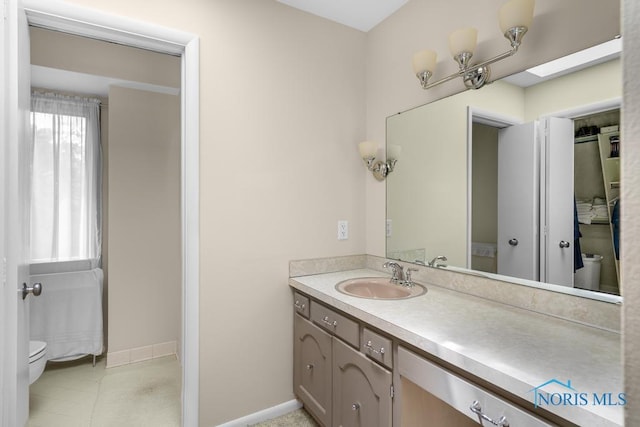 4123 Shamley Green Dr, Toledo, OH 43623 - bathroom featuring vanity, toilet, and baseboards