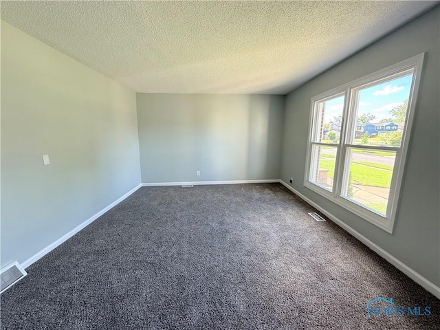 2655 101st St, Toledo, OH 43611 - unfurnished room with carpet flooring, a textured ceiling, and baseboards