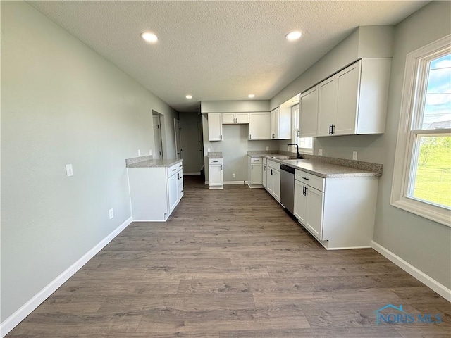 2655 101st St, Toledo, OH 43611 - kitchen with dishwasher, a textured ceiling, baseboards, white cabinets, and recessed lighting