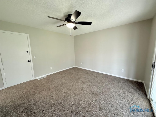2655 101st St, Toledo, OH 43611 - empty room featuring a ceiling fan, carpet flooring, a textured ceiling, and baseboards