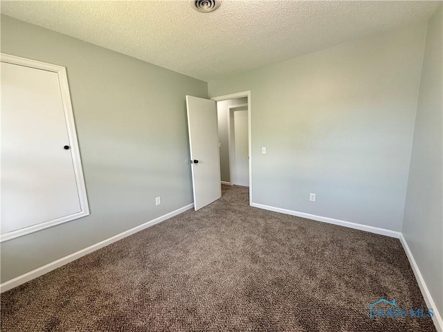 2655 101st St, Toledo, OH 43611 - unfurnished room with carpet, baseboards, and a textured ceiling
