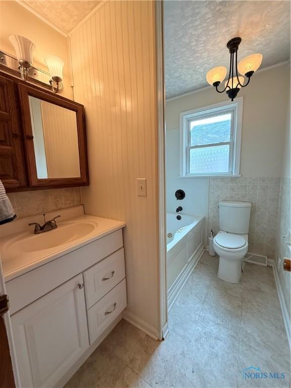 1641 Morrison Rd, Fremont, OH 43420 - full bath with vanity, toilet, and crown molding
