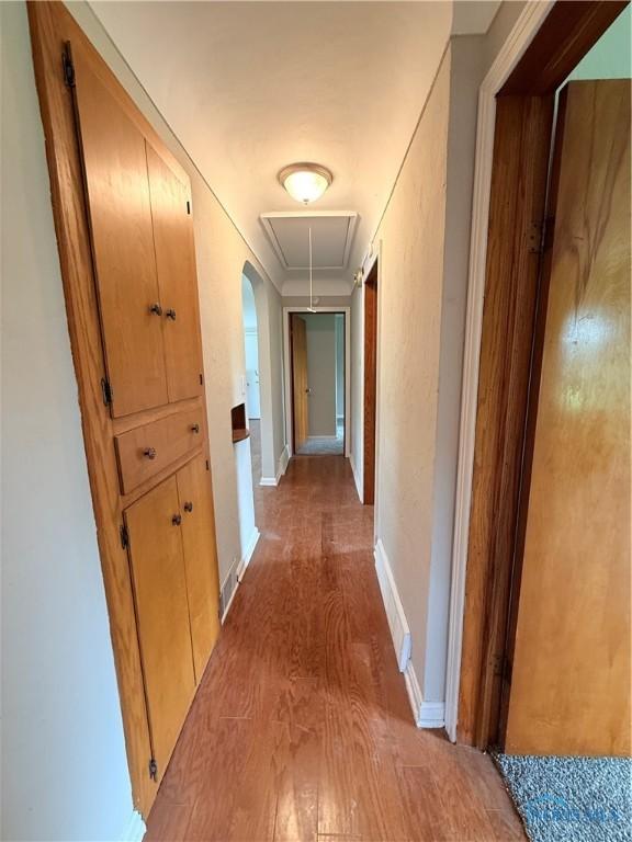 1641 Morrison Rd, Fremont, OH 43420 - hallway with attic access, light wood finished floors, and baseboards