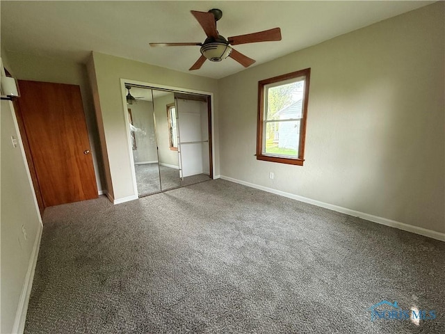 1641 Morrison Rd, Fremont, OH 43420 - unfurnished bedroom featuring carpet, a closet, baseboards, and a ceiling fan