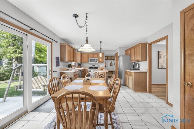 8225 Hidden Forest Dr, Holland, OH 43528 - dining room with light tile patterned flooring