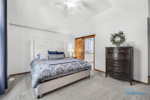 8225 Hidden Forest Dr, Holland, OH 43528 - bedroom with lofted ceiling, light colored carpet, a barn door, baseboards, and ceiling fan