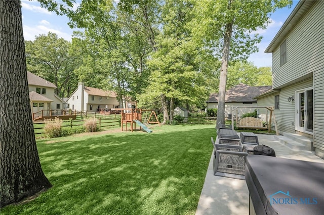 8225 Hidden Forest Dr, Holland, OH 43528 - view of yard with a playground and a patio
