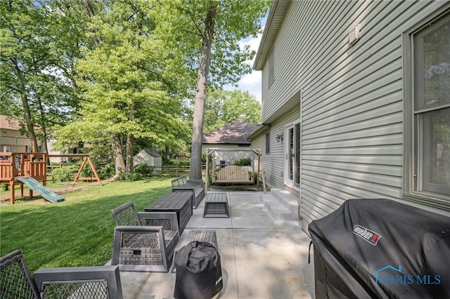 8225 Hidden Forest Dr, Holland, OH 43528 - view of patio / terrace with grilling area, a playground, and an outdoor living space