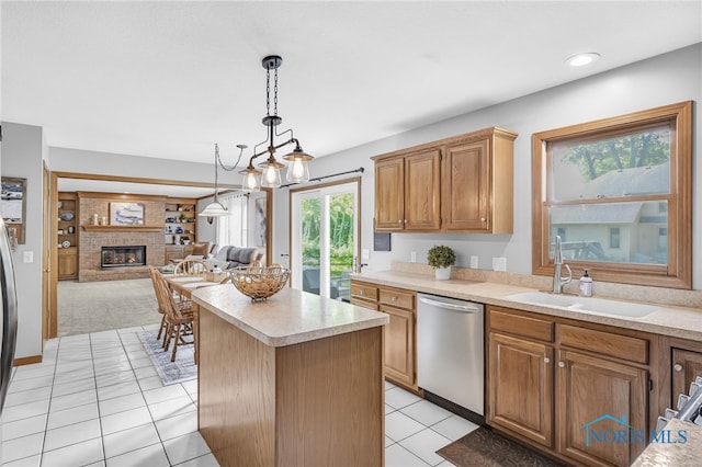 8225 Hidden Forest Dr, Holland, OH 43528 - kitchen with stainless steel dishwasher, a sink, light countertops, light tile patterned floors, and a kitchen island
