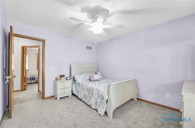 8225 Hidden Forest Dr, Holland, OH 43528 - bedroom featuring light colored carpet, baseboards, and a ceiling fan
