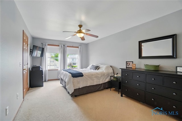28178 Schriber St, Walbridge, OH 43465 - bedroom featuring light colored carpet, baseboards, and ceiling fan