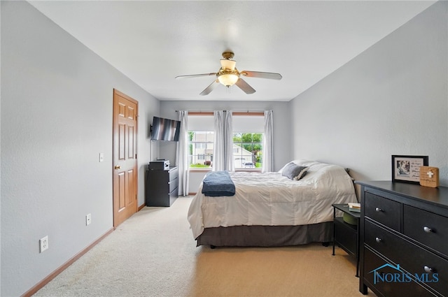 28178 Schriber St, Walbridge, OH 43465 - bedroom featuring light carpet, ceiling fan, and baseboards