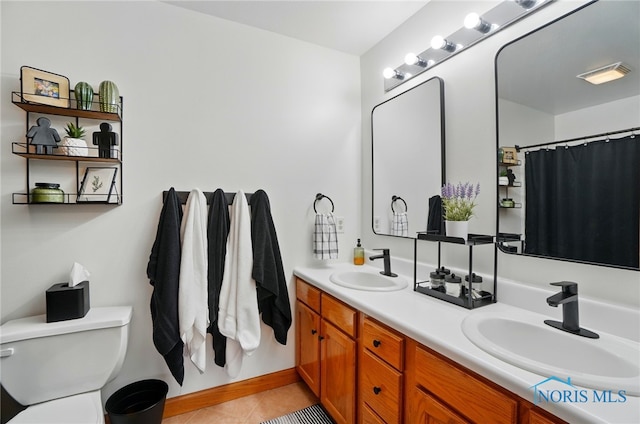 28178 Schriber St, Walbridge, OH 43465 - bathroom with double vanity, tile patterned flooring, and toilet