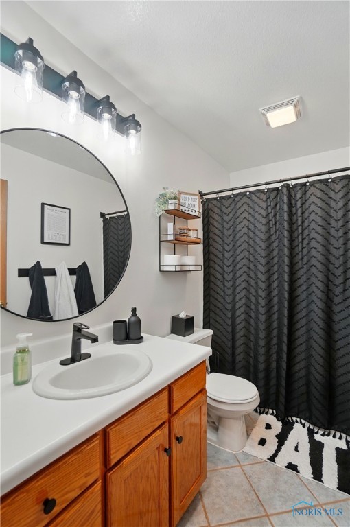 28178 Schriber St, Walbridge, OH 43465 - bathroom with vanity, toilet, tile patterned flooring, and curtained shower