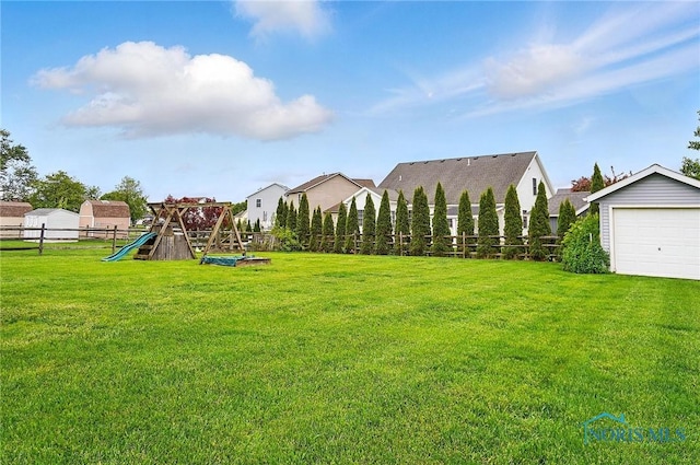28178 Schriber St, Walbridge, OH 43465 - view of yard with a playground and a garage
