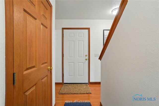 28178 Schriber St, Walbridge, OH 43465 - doorway to outside with light wood-style floors and baseboards