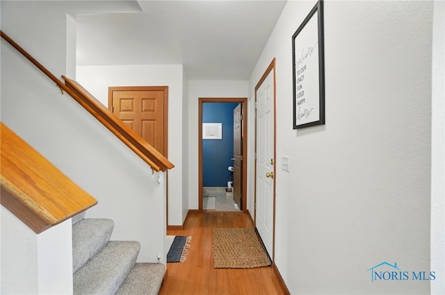 28178 Schriber St, Walbridge, OH 43465 - entrance foyer featuring light wood-style floors, stairway, and baseboards