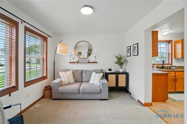 28178 Schriber St, Walbridge, OH 43465 - living room with light colored carpet, healthy amount of natural light, and baseboards
