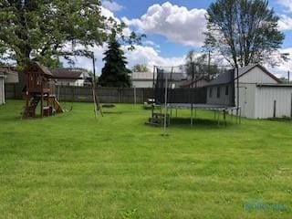 129 Central Ave, North Baltimore, OH 45872 - view of yard with a trampoline and a playground