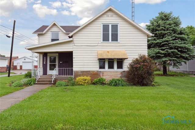 115 S 2nd St, North Baltimore, OH 45872 - view of front of property featuring a front lawn and stone siding