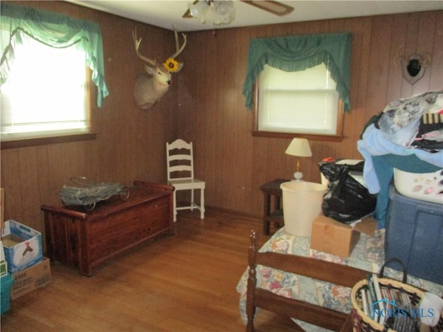 7358 State Route 15, Defiance, OH 43512 - interior space with wood finished floors, wood walls, and a ceiling fan