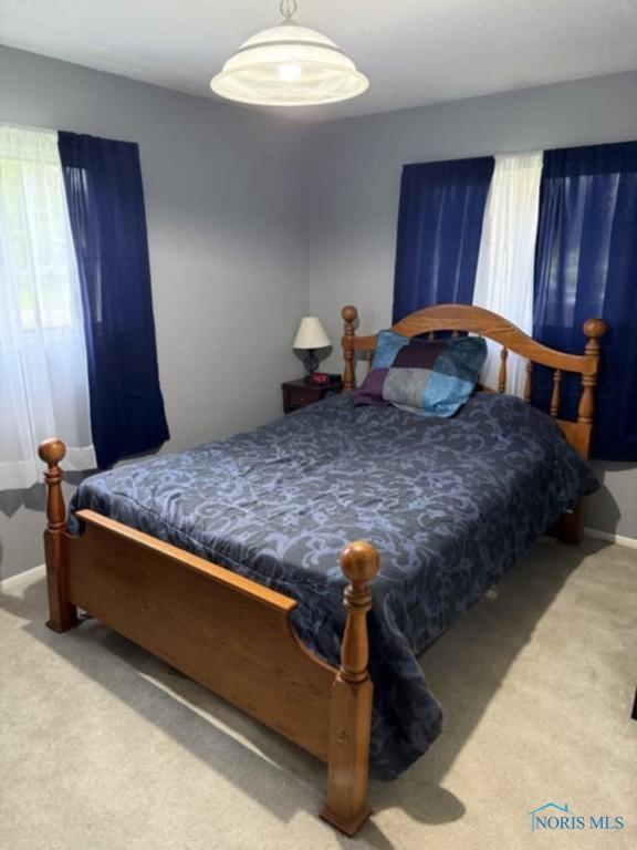 1133 Inverness Dr, Findlay, OH 45840 - bedroom with carpet flooring and baseboards