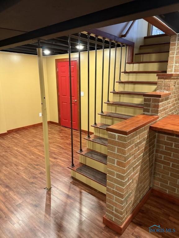 1133 Inverness Dr, Findlay, OH 45840 - finished basement with wood finished floors, stairs, and baseboards