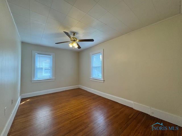 3635 Jackman Rd, Toledo, OH 43612 - spare room featuring wood finished floors, baseboards, ceiling fan, and ornamental molding