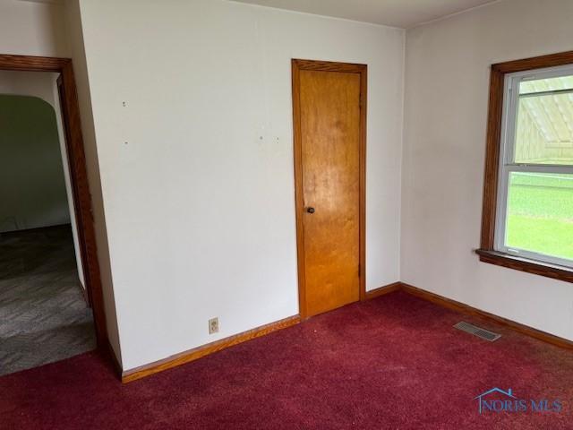 600 Tiedeman Ave, Defiance, OH 43512 - spare room featuring carpet floors, plenty of natural light, and baseboards