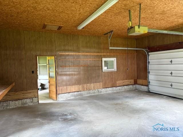 600 Tiedeman Ave, Defiance, OH 43512 - garage with a garage door opener and wooden walls