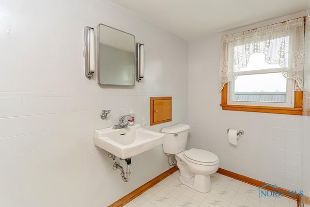 16470 County Road P, Napoleon, OH 43545 - bathroom featuring toilet, a sink, and tile walls