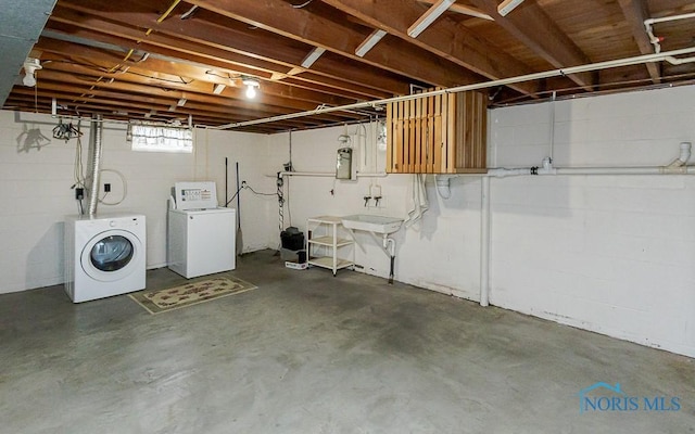 16470 County Road P, Napoleon, OH 43545 - basement with washer and clothes dryer, concrete block wall, and electric panel