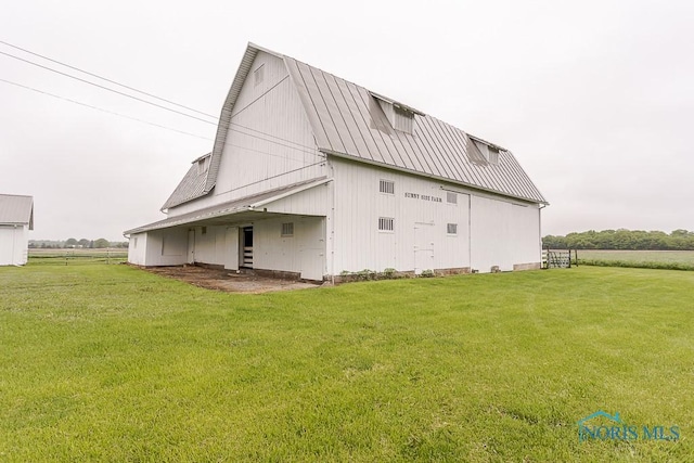 16470 County Road P, Napoleon, OH 43545 - back of property with a barn, an outdoor structure, a lawn, and metal roof