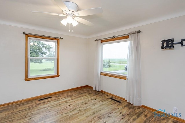 16470 County Road P, Napoleon, OH 43545 - spare room with wood finished floors, baseboards, and a ceiling fan