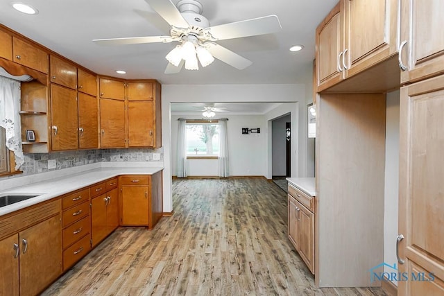 16470 County Road P, Napoleon, OH 43545 - kitchen with ceiling fan, light countertops, light wood-type flooring, brown cabinets, and recessed lighting