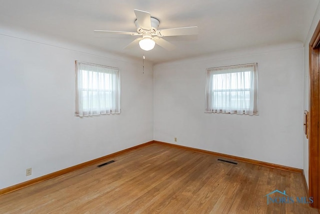 16470 County Road P, Napoleon, OH 43545 - unfurnished room featuring baseboards, wood finished floors, and ceiling fan