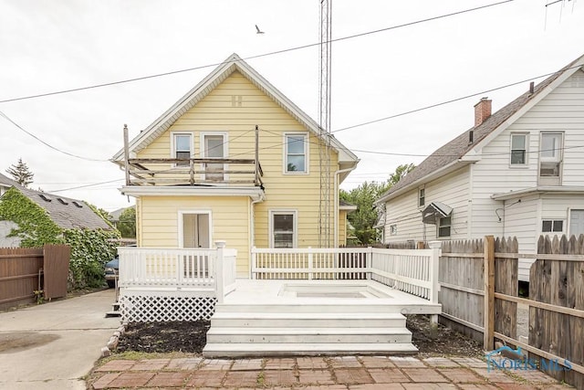 1385 Berdan Ave, Toledo, OH 43612 - back of house featuring a fenced backyard, a balcony, and a wooden deck