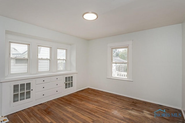 1385 Berdan Ave, Toledo, OH 43612 - empty room featuring dark wood-style flooring and baseboards