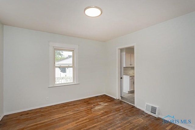 1385 Berdan Ave, Toledo, OH 43612 - unfurnished room featuring wood finished floors and baseboards