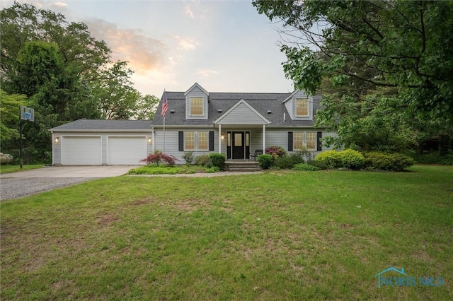 7424 Yawberg Rd, Whitehouse, OH 43571 - cape cod-style house featuring gravel driveway, a garage, and a front yard