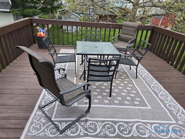 146 Partridge Ln, Perrysburg, OH 43551 - wooden terrace with outdoor dining space and a yard