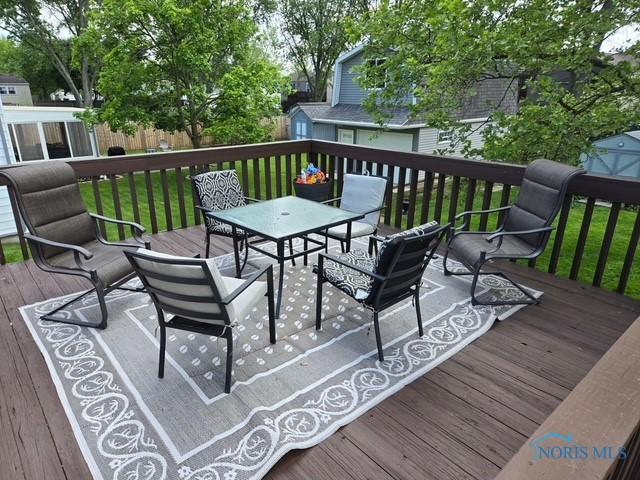 146 Partridge Ln, Perrysburg, OH 43551 - deck featuring outdoor dining space and a yard